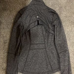 This is a Lululemon Define Jacket in a size two! It has been worn only 2 times!